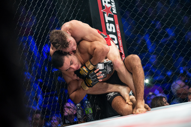 Hill attempts a submission on Alaoui || photo: Kieron Yates