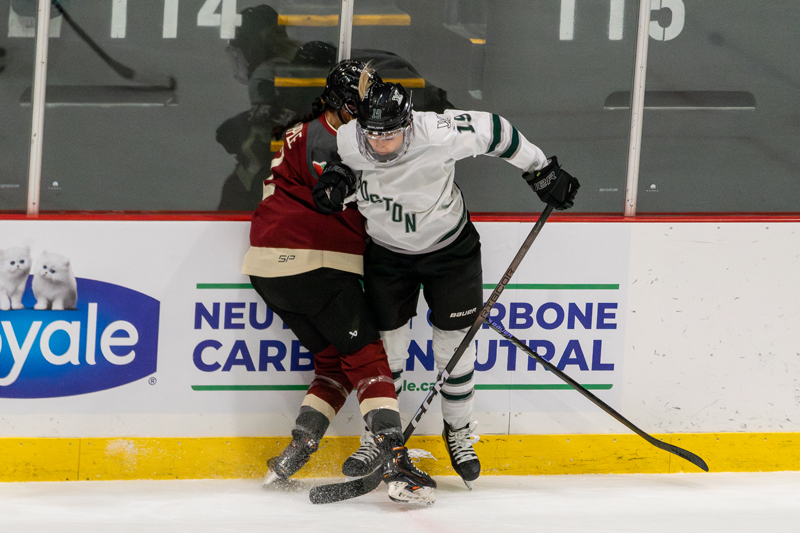 Boston's Gigi Marvin lays the body on Montreal's Mariah Keopple. | photo: Kieron Yates / Modern Free Press