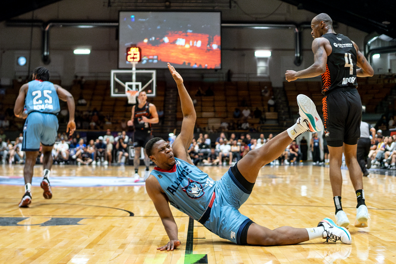 Alain Louis of the Montreal Alliance is fouled by Taze Moore of the Vancouver Bandits on July 28, 2024 at the Verdun Auditorium.