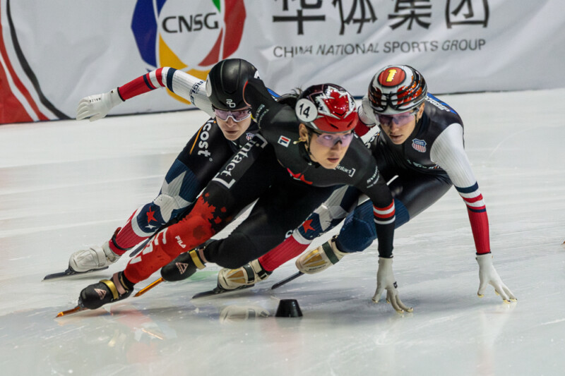 Canada's Courtney Sarault leads Kim Gilli of South Korea and Corrine Stoddard of the USA on her way to winning the Women's 1500m at the ISU Short Track World Tour in Montreal's Maurice Richard arena on October 12th, 2025. Photo: Kieron Yates
