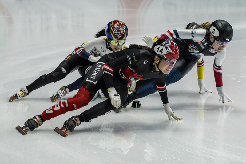 Canada's Courtney Sarault leads Kim Gilli of South Korea and Corrine Stoddard of the USA on her way to winning the Women's 1500m at the ISU Short Track World Tour in Montreal's Maurice Richard arena on October 12th, 2025. Photo: Kieron Yates